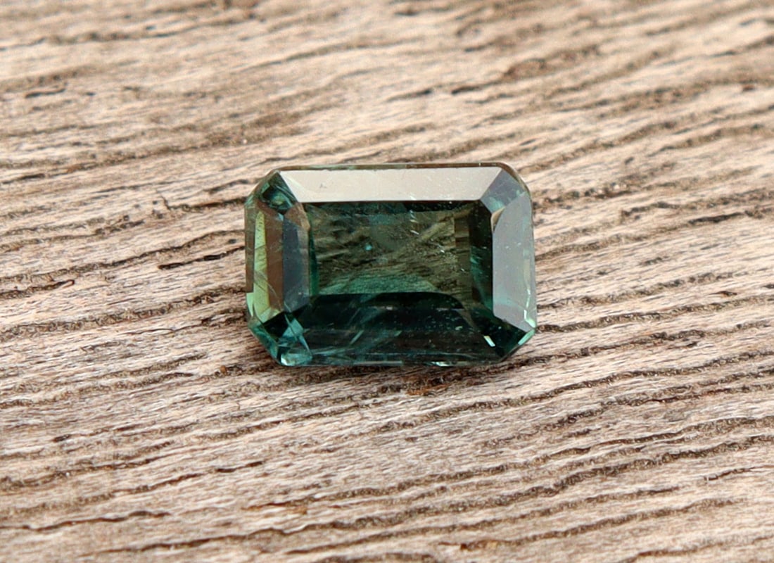 GSI Certified Unheated Natural Sapphire 0.63 Carats: Title:1.73 Carats Natural Sapphire Description:Gemstone: Natural SapphireCarat Weight: 1.73Shape/Cut: Pear CutMeasurements: 10.77x6.53x3.11 mmColor: Blueish GreenTransparency: TransparentClarity : Thi