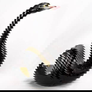 1950s Maddux Black Swan Ceramic Planter: Title:1950s Maddux Black Swan Ceramic Planter Size:7 &frac12; in (19.0 cm) long x 4 &frac12; (11.4 cm) in wide x 11 in (27.9 cm) tall. Description:A Maddux black swan planter that appears to have neve