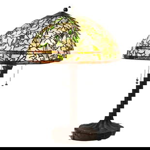 25.75" Daffodil Stained Glass Table Lamp: 25.75" Tall x 18 w " Illuminate your space with the timeless beauty of our reproduction stained glass daffodil table Lamp. This exquisite lamp features a hand-made stained glass shade and an antique b