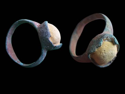 Ancient Roman Bronze Ring with Stone Inlay (1st-4th Century AD): Title: Ancient Roman Bronze Ring with Stone Inlay (1st-4th Century AD) Description: This is a stunning and rare ancient Roman bronze ring, featuring a raised bezel with an embedded stone, likely from