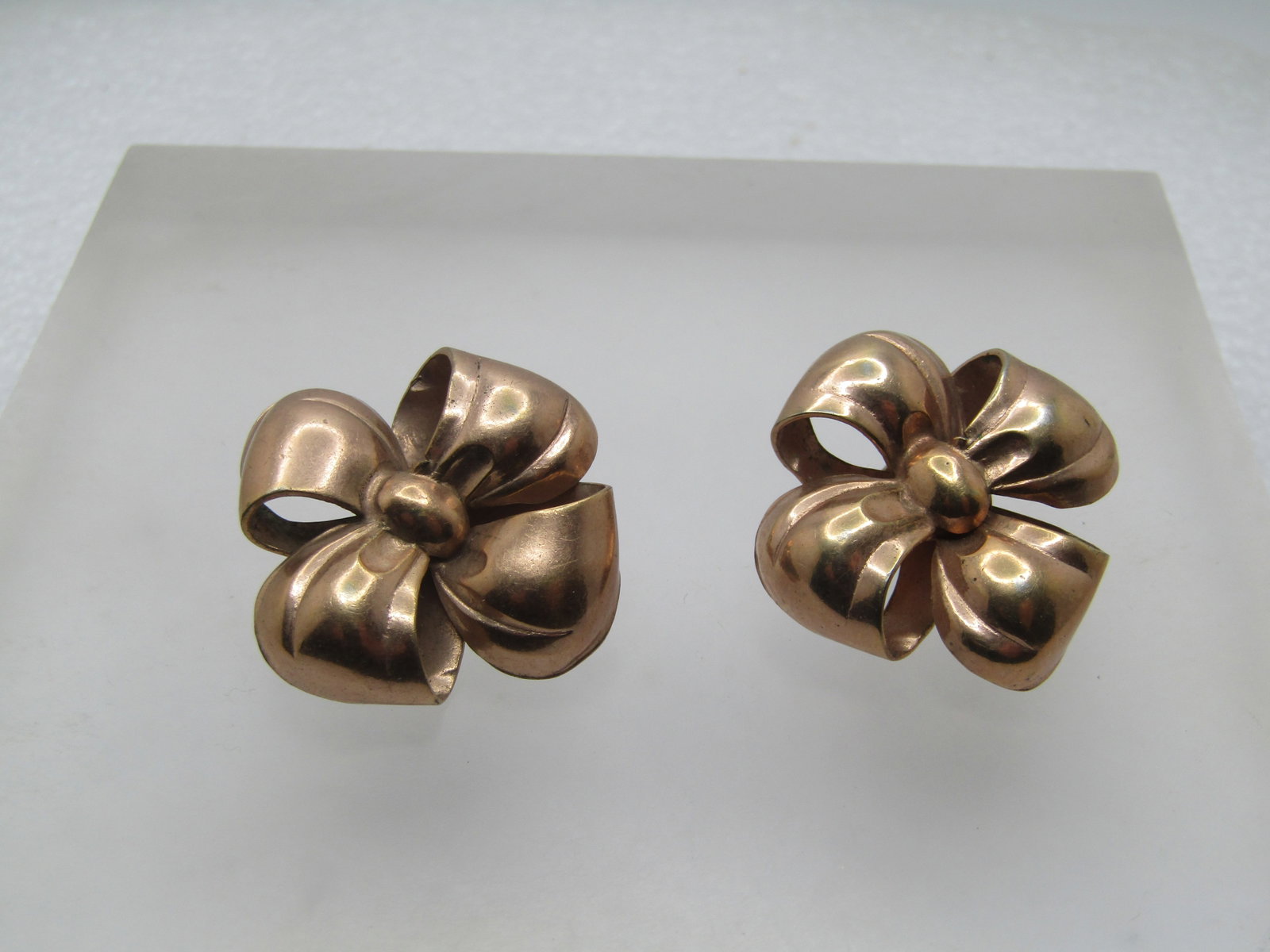 Vintage 10kt G.F. Bow Earrings, Clip, 1940's-1950's: Vintage 10kt G.F. Bow Earrings, Clip, 1940's-1950's. These are appx. 1" square, four-looped bow with a rounded center. 3-D design. Yellow gold filled. They test as 10kt G.F. Their weight is appx.5.68 