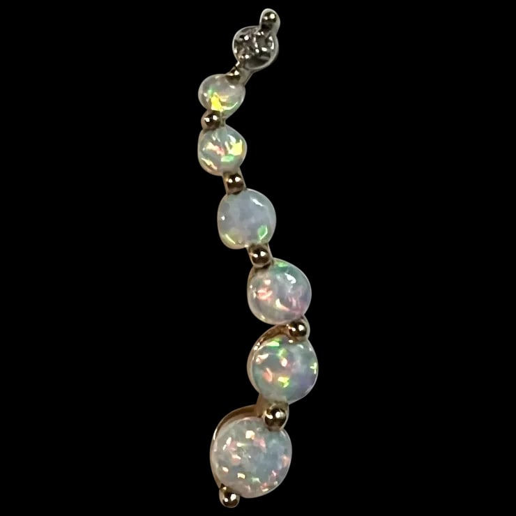 Estate 10k Gold STS Opal and Diamond Pendant: Title: Estate 10k Gold STS Opal and Diamond Pendant Description: Estate 10k Gold STS Opal and Diamond Pendant Hallmarked: 10k, STS Yellow Gold 6 Opals, 1 Diamond Weighs 1 grams Date/Period: Estate Mat