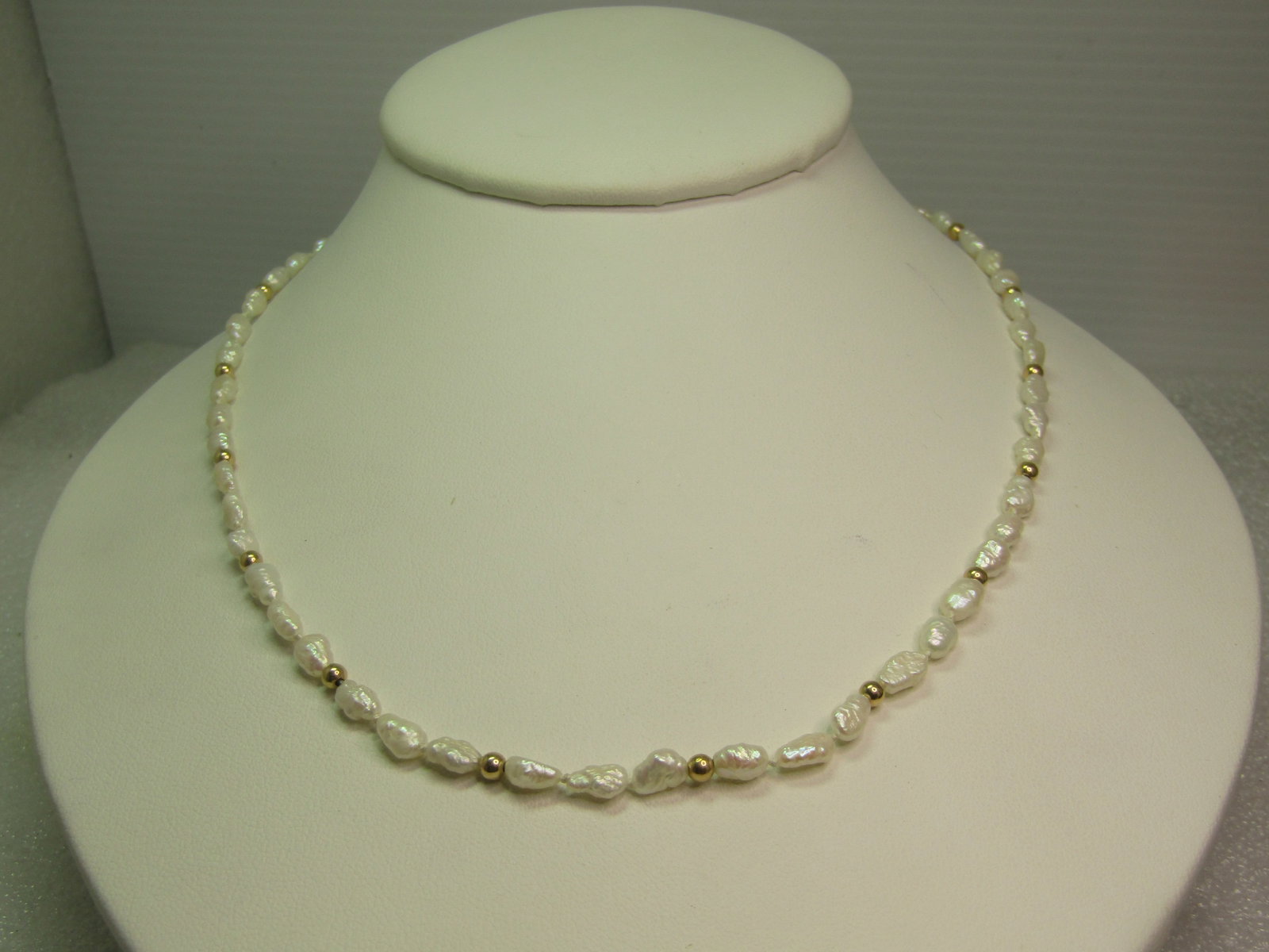 Vintage 14kt Freshwater Pearl Necklace, Gold Beads, 18", 1980's-1990's, Signed: 14kt Freshwater Pearl Necklace, Gold Beads, 18", 1980's-1990's, Signed I.P.S.. This has white freshwater pearls that are appx. 3.5mmon average in width. There are appx. 2.9mm and also test as 14kt . S