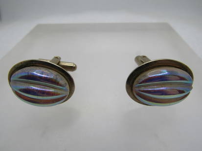 Vintage Iridescent Glass Cufflinks, 1950's-1960's: Vintage Iridescent Glass Cufflinks, 1950's-1960's. Oval gold tone setting that holds a triple ridged glass aurora borealis iridescent glass stone that is oval and appx. 18mm by 13mm. Gold tone with sw