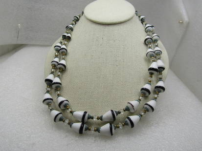 Vintage  Double Strand Black & White Glass Beaded Necklace, 21": Vintage Double Strand Black & White Glass Beaded Necklace, 21" with conical shaped beads and end caps on each bead and a faceted clear bead between. Floral clasp with aurora borealis rinestones. The b