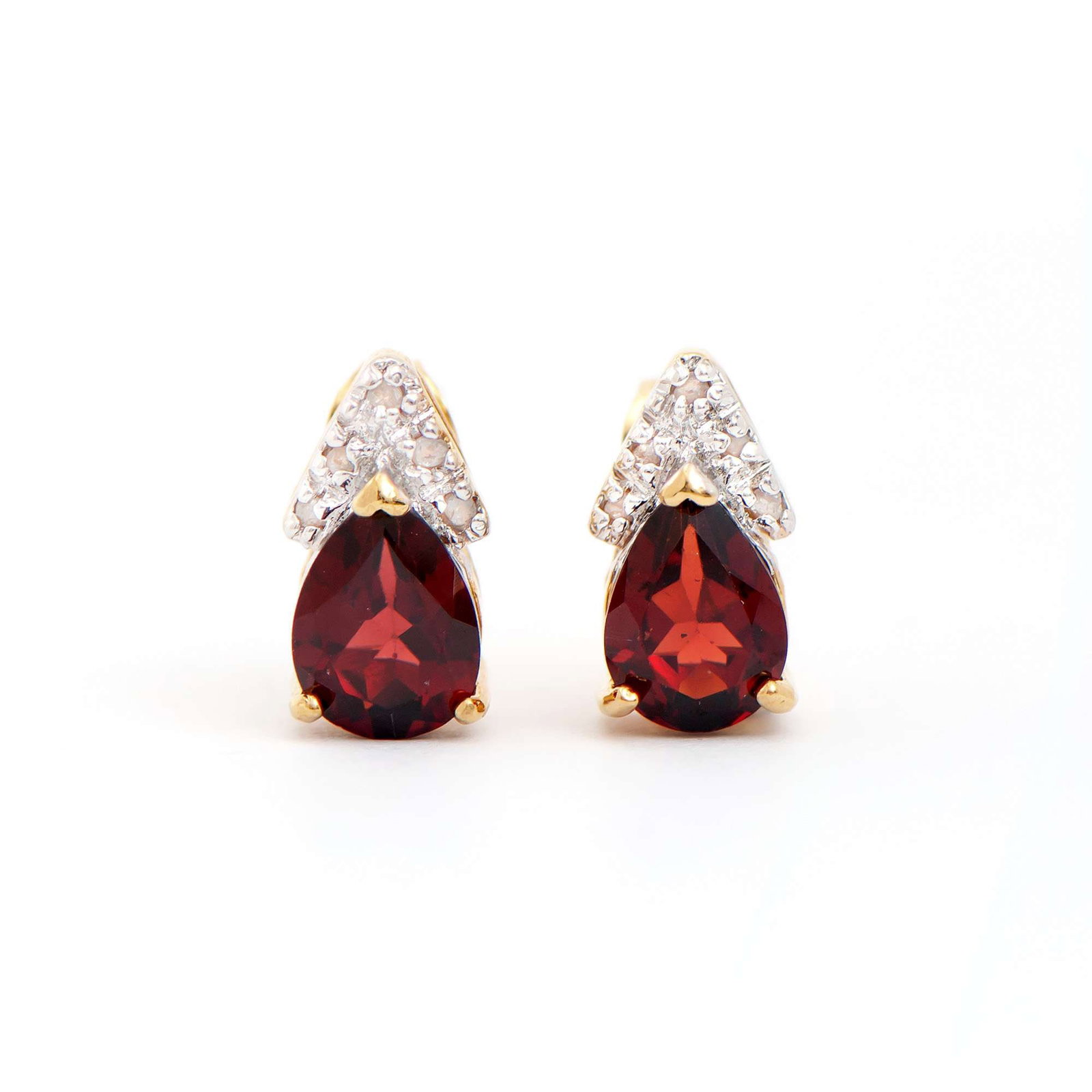 2.12 ctw Garnet & Diamonds 18K Gold Plated Designer Earrings: Title: 2.12 ctw Garnet & Diamonds 18K Gold Plated Designer Earrings Stone 1: Garnet Color: Brown Shape: Pears Size: 8x6 Quantity: 2 CTW: 2.04 Stone 2: Diamonds Color: H-I Shape: Rounds Size: 1.1mm Qua