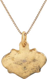 VIKING HEART PENDANT 850-1050 AD.: Large example just under 1&#8221; (0.94&#8221;)&#8221; width of the flat form, made by the open face mold process. The cusped top formed by low relief scrolls. Nubs at the quarter-point defining a sal