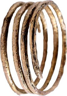ANCIENT VIKING COIL RING, C.850-1050 AD, SIZE 10 1/4: Size 10 &#188;, 3 &#189; coils to 6.7mm, over &#188;&#8221; width. Circular section helix, of gold over bronze. Made by the lost-wax process, coil beads, rings, and other adornments were very popular