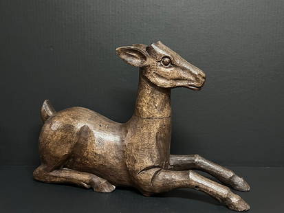 Large Sitting Deer Sculpture: Title: Large Sitting Deer Sculpture Date/Period: Late 20th Century Dimension: 13" h x 19" w Material: Wood Additional Information: Folk Art Carved Wood Large Sitting Deer Sculpture Reserve: $300.00 Sh