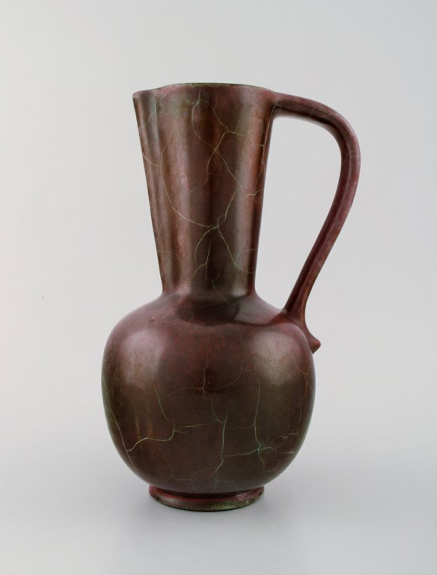 Richard Uhlemeyer, German ceramist. Ceramic jug/vase, beautiful cracked glaze in red shades.: Richard Uhlemeyer, German ceramist. Ceramic jug/vase, beautiful cracked glaze in red shades. Germany, 1940/50s. Measures 25 cm. x 18 cm. In perfect condition. Stamped. Reserve: $294.00 Shipping: Dome