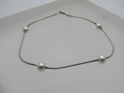 Vintage Sterling Faux Pearl Bracelet, 7.5", 1970's-1980's: Vintage Sterling Faux Pearl Bracelet, 7.5", 1970's-1980's. It has four faux pearls that are appx. 4.5mm strung/fused to the silver 1mm round snake chain. Spring clasp where it is marked .925 and Italy