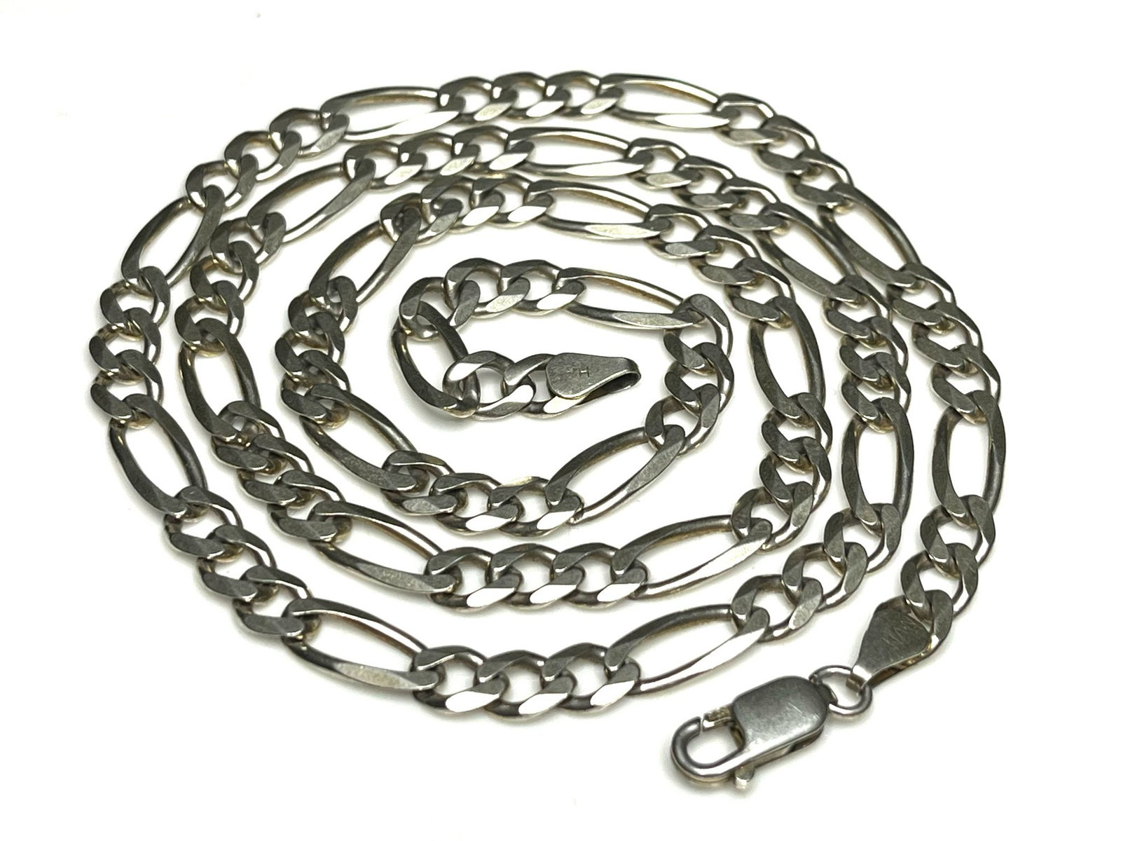 Estate Sterling SIlver Figaro Necklace: Title: Estate Sterling SIlver Figaro Necklace Description: Estate Sterling Silvers Figaro Necklace Hallmarked: HAN 925 ITALY Weighs 25.6 grams Necklace Measures Approx. 24 inches Date/Period: Estate M