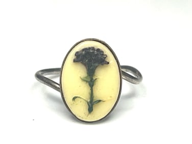 Vintage Silver Ring with Raised Flower on Ivory Colored Background