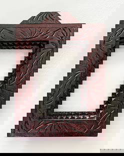 Tramp Art Frame with Incised Carvings: Title: Tramp Art Frame with Incised Carvings Description: A nice deep tramp art frames with incised carvings. The top is extended and the ends of the lines have a punched floral decoration. Excellent