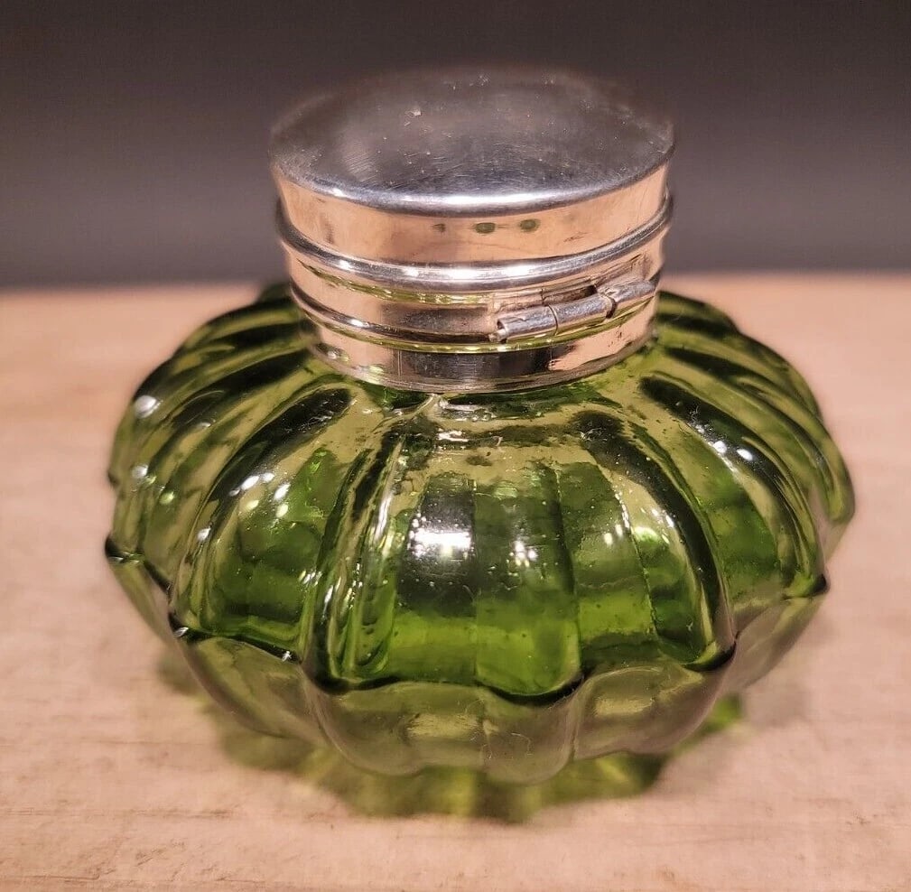 Round Green Glass Inkwell Ink pot Bottle: Vintage Antique Style Round Solid Green Glass Inkwell Ink pot Description 2 1/4" High x 3 1/8" wide Charming Reproduction antique green glass inkwell ink bottle. Charming with subtle signs of being ha