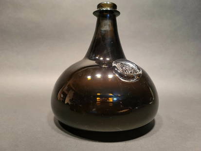 8" Black Glass Blown Onion Wine Bottle Green: Description 8" Tall x 7 1/2" Wide Great reproduction onion bottle with a polished pontil. See the images the bottom has some scratches and scuffs, no cracks or chips.. Reserve: $58.00 Shipping: Domest