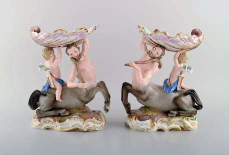 A pair of antique figurative Meissen compotes in hand-painted porcelain. Puti on centaur carrying: A pair of antique figurative Meissen compotes in hand-painted porcelain. Puti on centaur carrying large seashell. Museum quality. Dated 1815-1860. Measures: 26 x 21 cm. In excellent condition. Stamped