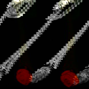 Art Deco Platinum Natural Diamond and Coral Earrings: Title: Art Deco Platinum Natural Diamond and Coral Earrings Description: Vintage from the 1920s Materials: Platinum Gemstone: Coral These stunning earrings feature an intricate design with 70 sparklin