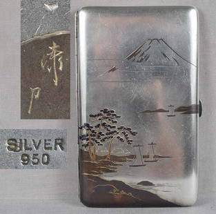 19c Japanese silver cigarette case Mt FUJI LANDSCAPE by ICHIRYO: Late 19th century to 1920s good size Japanese sterling silver and copper cigarette case with inlaid and carved landscape of snow covered Mount Fuji rising above clouds, and a wide bay with rocks, pine