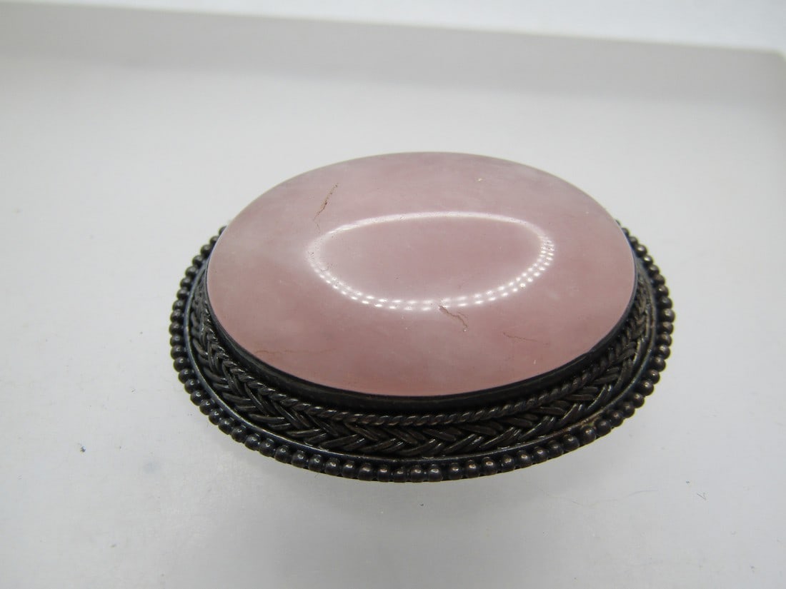 Vintage Sterling Pink Quartz Brooch, 1950's-1960's: Vintage Sterling Pink Quartz Brooch, 1950's-1960's. This has an oval 31mm by 22.5mm pink quartz that is bezel-set with a frame that tapers downward and widens with beaded, rope and criss-cross accents