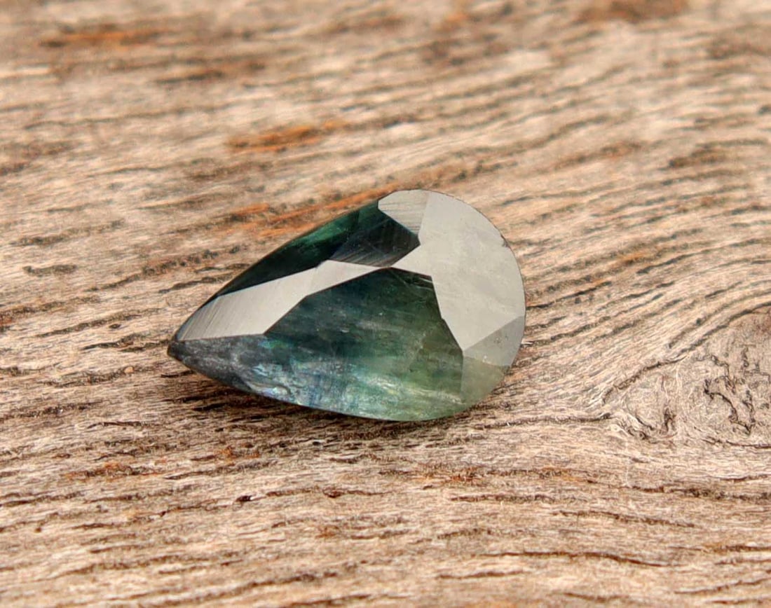 1.06 Carats Natural Sapphire: Title:1.06 Carats Natural Sapphire Additional Info:Gemstone: Natural SapphireCarat Weight: 1.06Shape/Cut: Pear CutMeasurements: 8.36x5.32x2.82 mmColor: Blueish GreenTransparency: TranslucentClarity: T