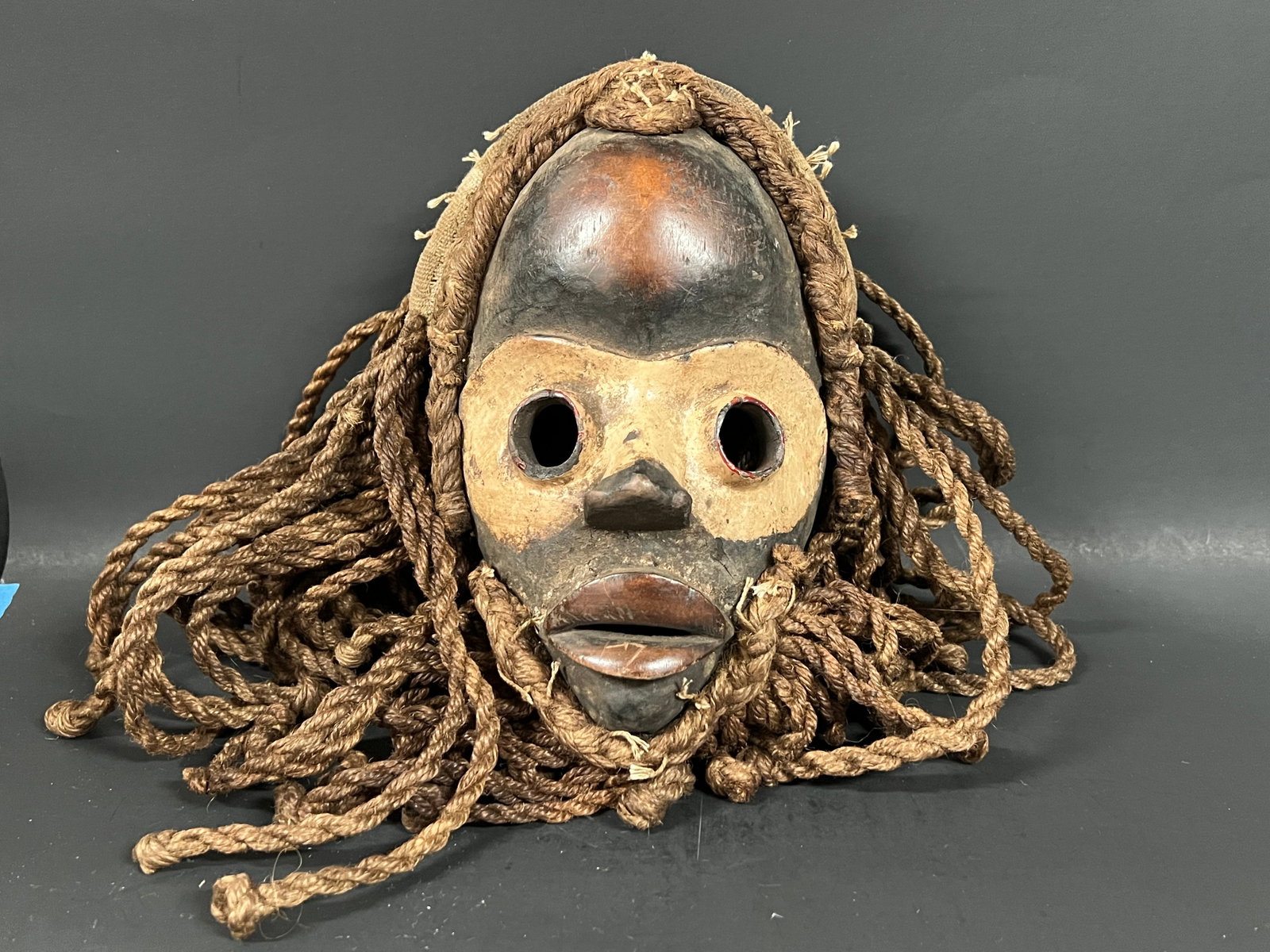 Dan Mask: Title: Dan Mask Date/Period: Late 20th Century Dimension: 10" h x 6" w Material: Wood Additional Information: African Tribal Art Dan Mask Reserve: $120.00 Shipping: Domestic: Flat-rate of $30.00 to an