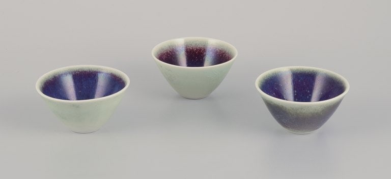 Three Rörstrand ceramic bowls with glaze in violet and green shades. (1 of 9)