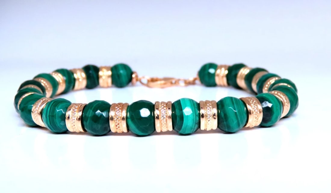 Malachite Roundel Bracelet 14kt 12464: Title Malachite Roundel Bracelet 14kt 12464 $600.00 PRODUCT DESCRIPTION 8mm natural malachite beads strung with 14 kt gold roundels 7.5 inch long 22.7 grams Reserve: $480.00 Shippin