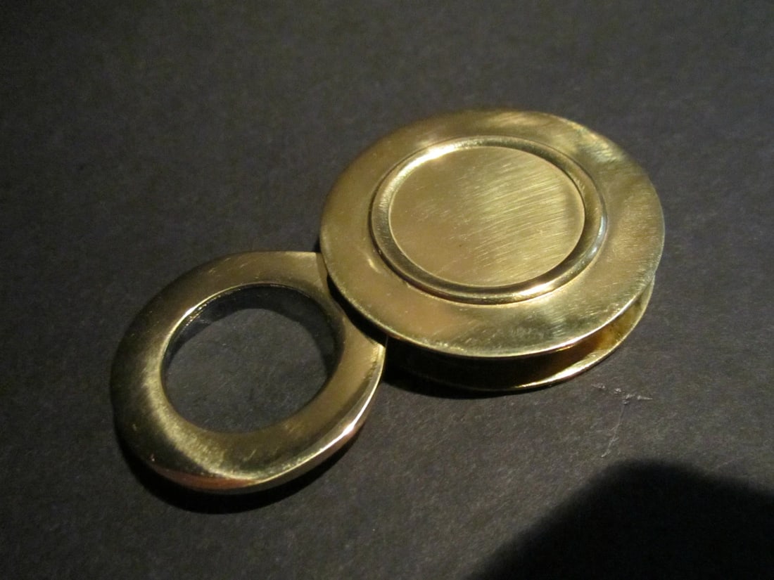 Brass Pocket Folding Optical Glass Magnifying Lens Loupe: VIntage Style, Brass Pocket Folding Optical Glass Magnifying Lens Loupe Description 1 3/4" Wide Nice reproduction of an antique flip out Magnification lens. All brass with a felt covered bottom. Magni