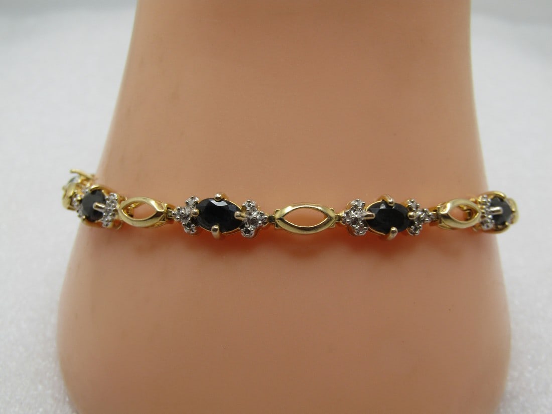 Vintage Sterling Vermeil Sapphire Illusion Tennis Bracelet, 8", 1980's-1990's: Vintage Sterling Vermeil Sapphire Illusion Tennis Bracelet, 8", 1980's-1990's. This is appx. 5.8mm wide with box clasp and two safety locks. It is marked .925 and has gold plated finish on top. ON eac