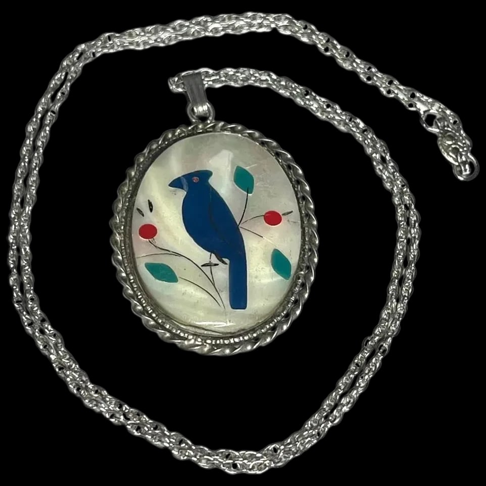 Vintage Sterling Blue Jay Necklace: Title: Vintage Sterling Blue Jay Necklace Description: Vintage Sterling Blue Jay Necklace Chain Hallmarked: Sterling Weighs: 8.2 grams Chain Measures: 18 inches Pendant Measures: 1.75 x 1 inch Date/Pe