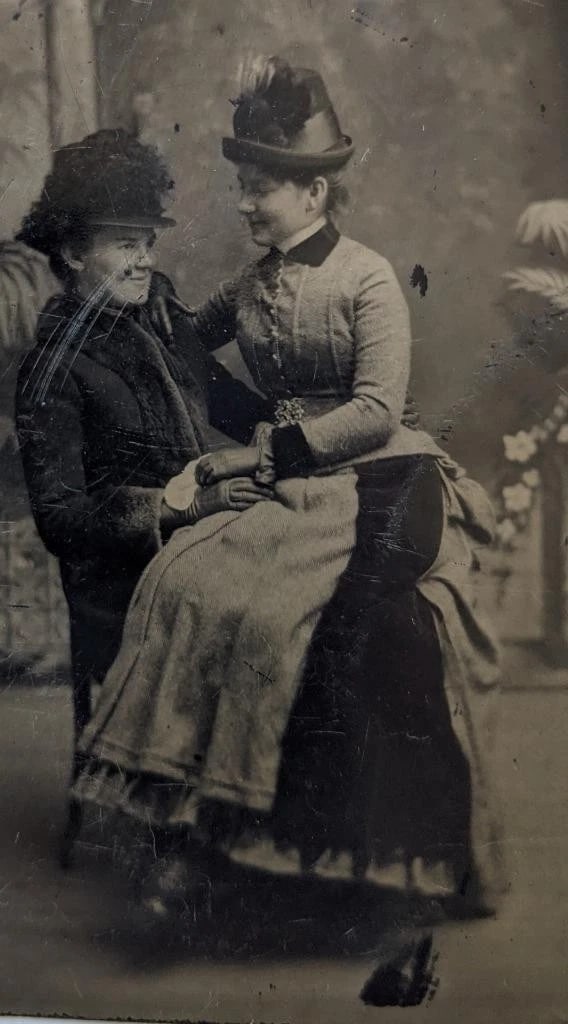 c 1880 s TINTYPE, UNCOMMON FEMALE AFFECTION POSE, WOMAN HOLDS OTHER WOMAN on LAP: c 1880 s TINTYPE, UNCOMMON FEMALE AFFECTION POSE, WOMAN HOLDS OTHER WOMAN on LAP c 1880 s TINTYPE, UNCOMMON FEMALE AFFECTION POSE, WOMAN HOLDS OTHER WOMAN on LAP Circa 1880s Antique Tintype Photograph