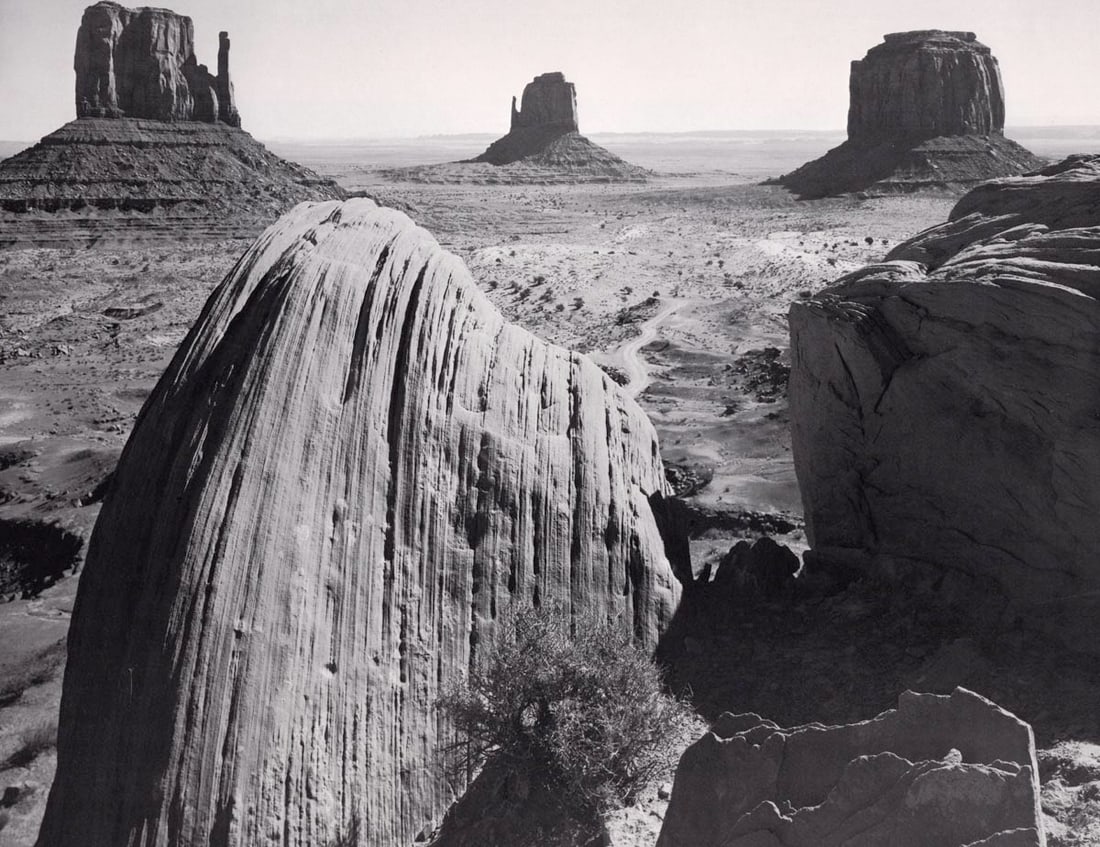 ANSEL ADAMS - Monument Valley, Utah, c.1958: Artist: ANSEL ADAMS Print Title: Monument Valley, Utah, c.1958 Medium: Photolithograph Printed 1981 in the US Image Size: approx. 11.5 x 14” Ansel Easton Adams (1902 – 1984),was an Ameri