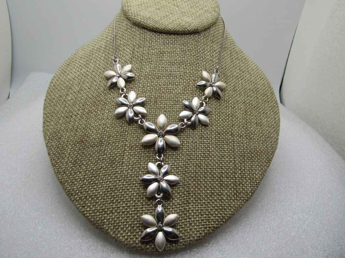 Vintage Floral Blossom & Rhinestone Drop Necklace, 18", 1980's-1990's: Vintage Floral Blossom & Rhinestone Drop Necklace, 18", 1980's-1990's. Silver tone with alternating petals of bright and shiny and brushed finish. Five blossom cross the front of the neck with two dro