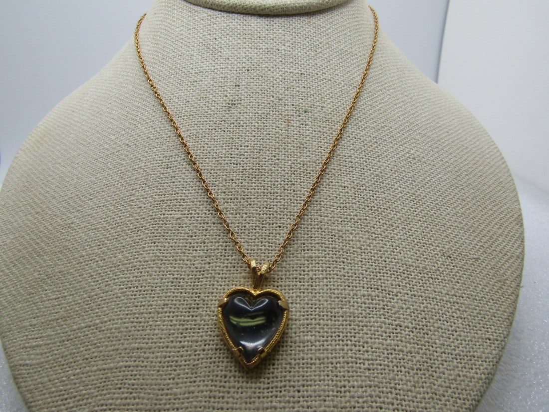 Vintage Blue Glass Heart Necklace, 16", 1960's-1970's: Vintage Blue Glass Heart Necklace, 16", 1960's-1970's. Gold tone heart with a blue glass prong-set heart. The pendant is appx. 1" tall and 3/4" wide. It is on a 16" gold tone chain with spring clasp. 
