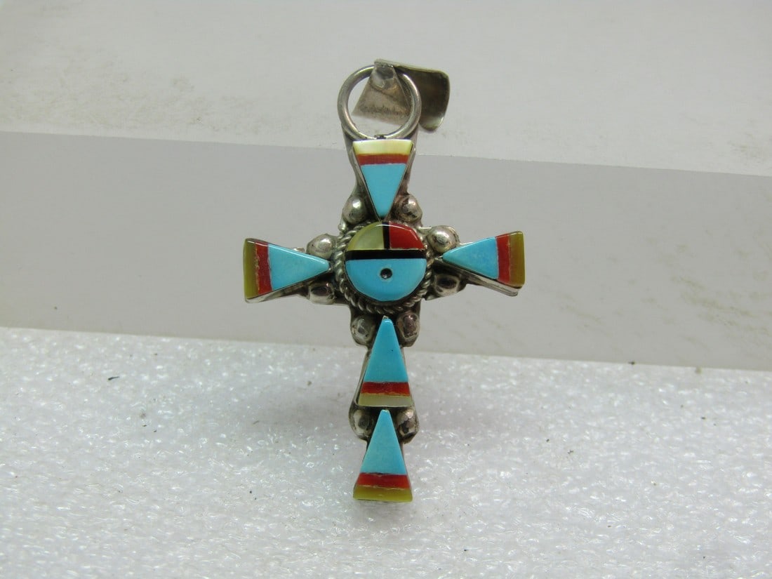 Vintage Sterling Southwestern Inlaid Zuni Cross Pendant, 1970's-1980's: Vintage Sterling Southwestern Zuni Cross Pendant, 1970's-1980's. Sterling cross and wide swing bail . The pendant is appx. 1.75" tall and 1" wide with raised bezel-set inlaid turquoise/red coral/mothe