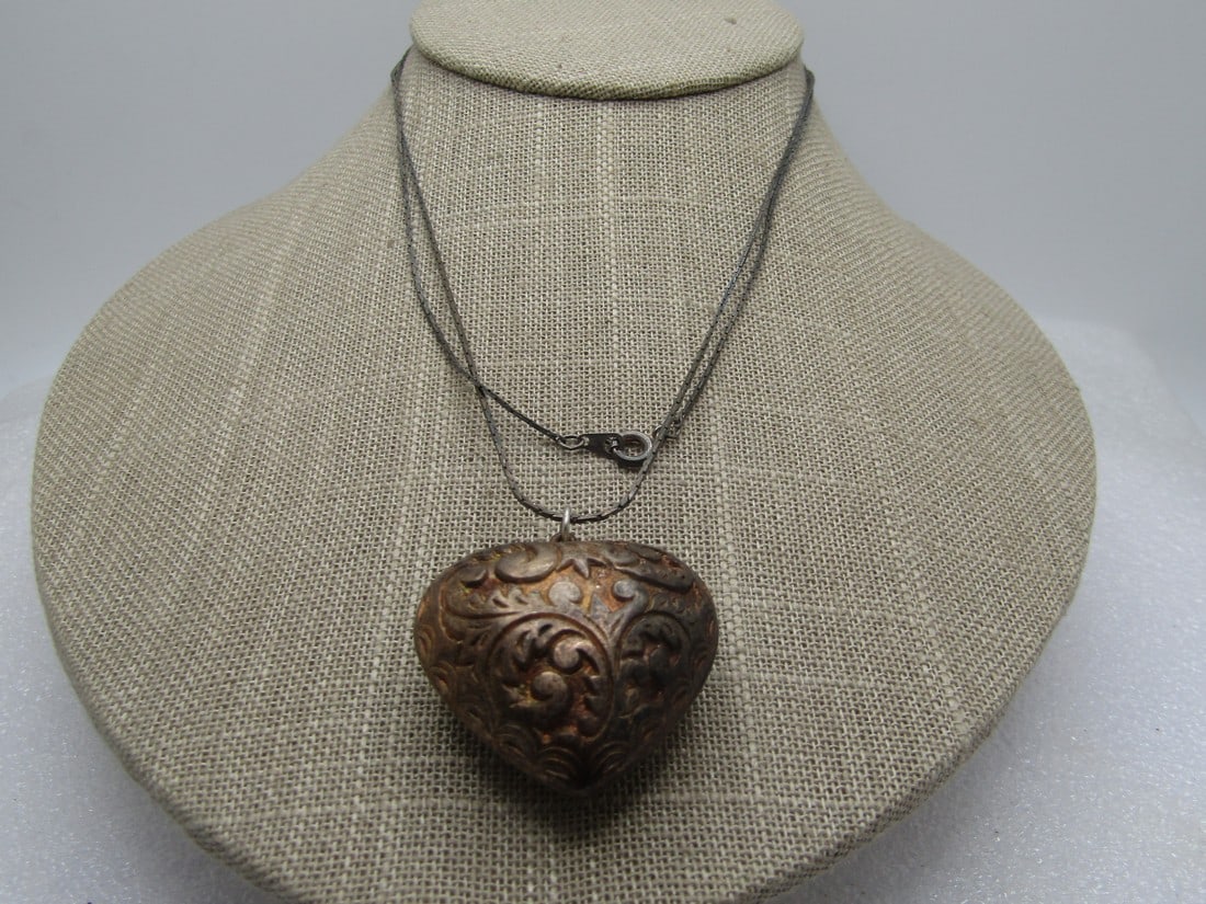 Vintage Silver Puffy Scrolled Heart Necklace, 28", 1970's: Vintage Silver Puffy Scrolled Heart Necklace, 28", 1970's. The heart is testing as silver with acid testing; however, some areas seem weaker so it is a bit of a mystery. It is possible it is plated bu