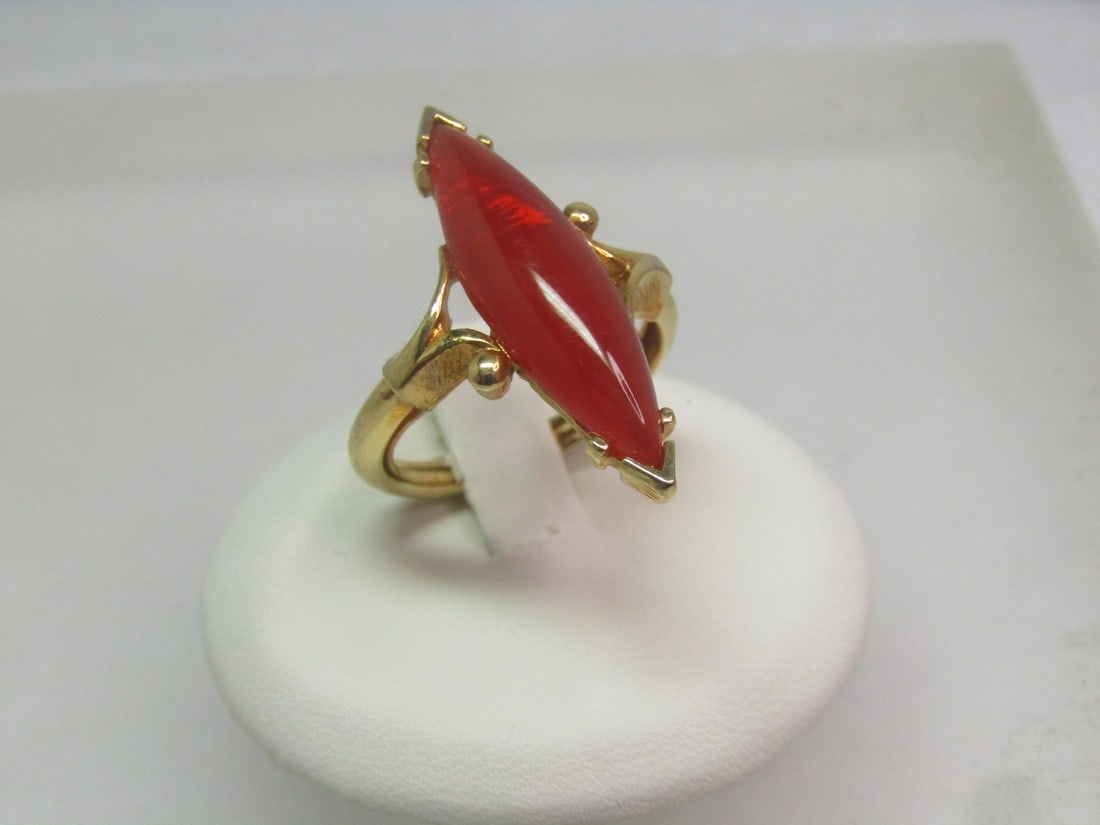 Vintage Avon Faux Carnelian Ring, Long, Sz. 4-6, 1970's: Vintage Avon Faux Carnelian Ring, Long, Sz. 4-6.5, 1970's. The ring has a long and pointed faux carnelian stone that is appx. 1-1/8" long and 1/3" wide at the center but ends pointed one ach end with 