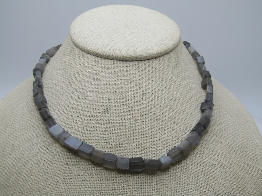 Donna Karan Gray Agate Necklace, 16", Signed DKNY, 1980's-1990's: Donna Karan Gray Agate Necklace, 16", 1980's-1990's. The gray agate beads are cube-ish and aveage appx. 6mm, slightly differ on each stone. The necklace is 16" long with a silver tone hook clasp and r
