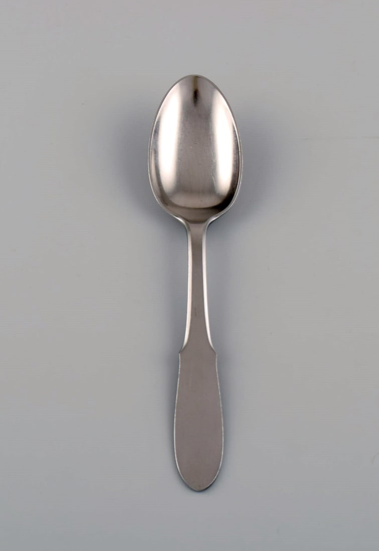Gundorph Albertus for Georg Jensen. Mitra stainless steel dessert spoon. 1970s. Twelve pieces in: Title:Gundorph Albertus for Georg Jensen. Mitra stainless steel dessert spoon. 1970s. Twelve pieces in stock. Description:Gundorph Albertus for Georg Jensen. Mitra stainless steel dessert spoon. 1970s