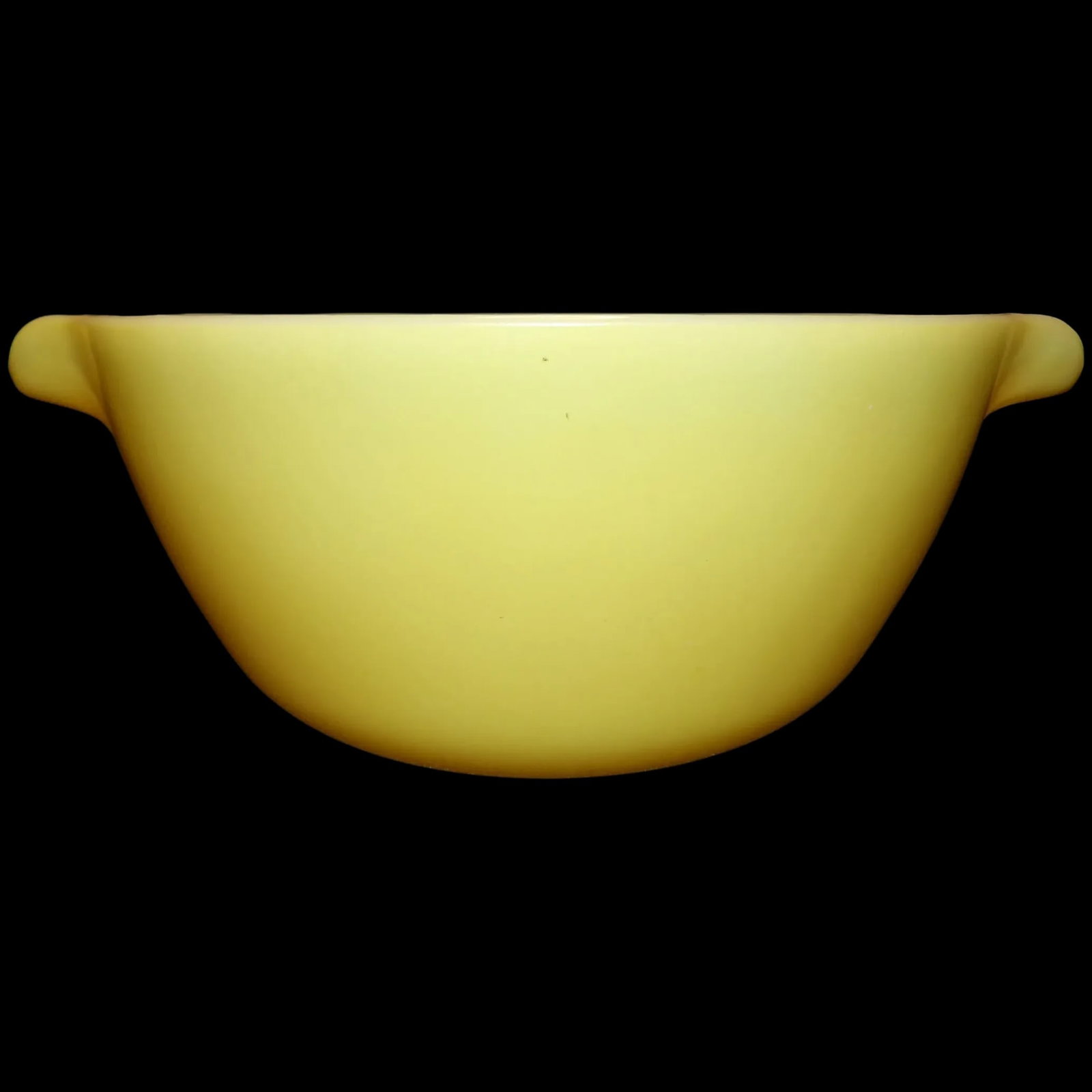 Fire King Yellow Cinderella Bowl #11: This Fire King Yellow Cinderella Bowl #11 is in excellent condition. It does have wear on bottom (see photo). It is clean inside and out with no stains. It measures 11 ½” spout to pout and 