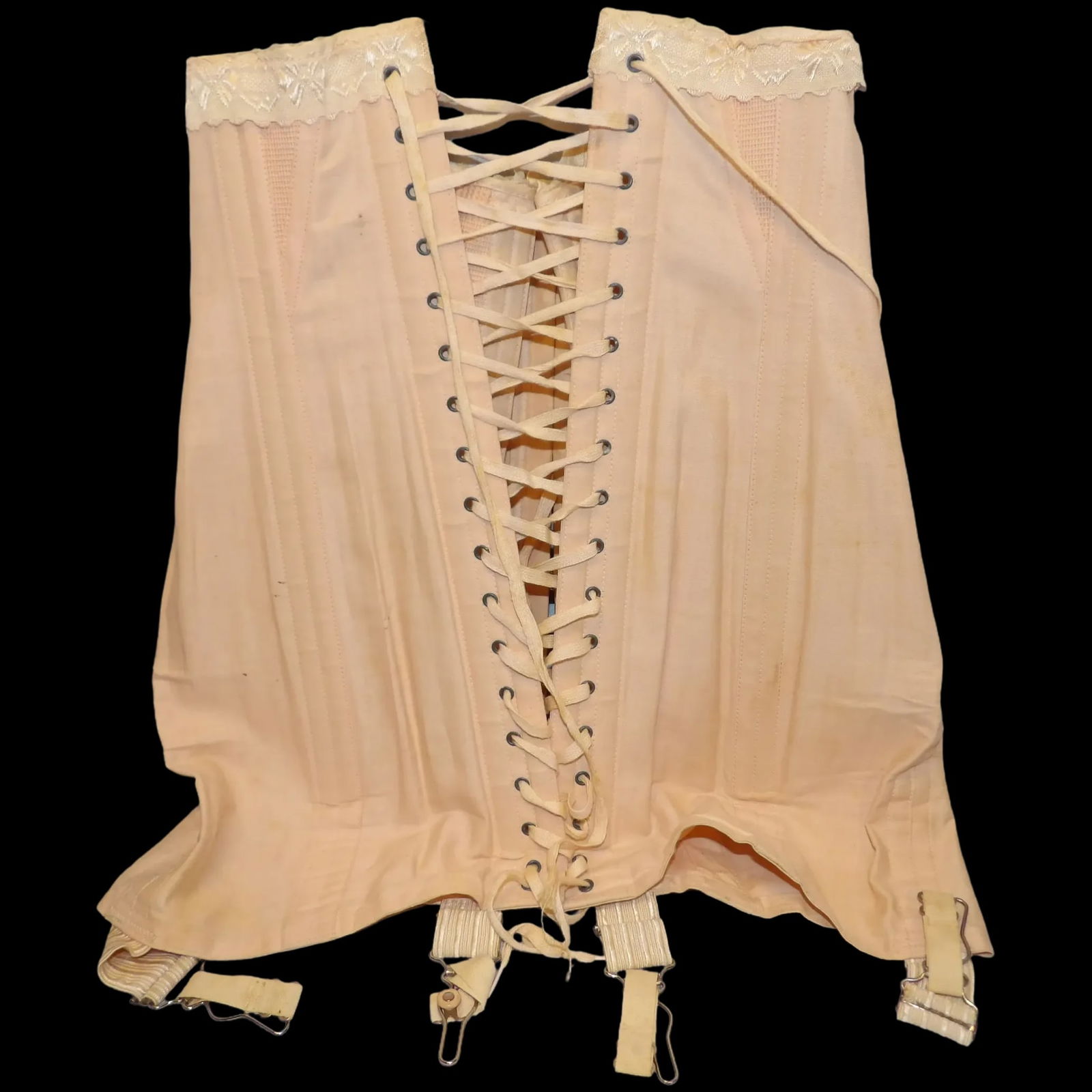 Antique Pink Steel Boned Over Bust Corset: This Antique Pink Steel Boned over Bust Corset is in excellent condition. Original laces, hooks are all without rust etc. The front laces allow you to compensate for breast size. The lace at the top o