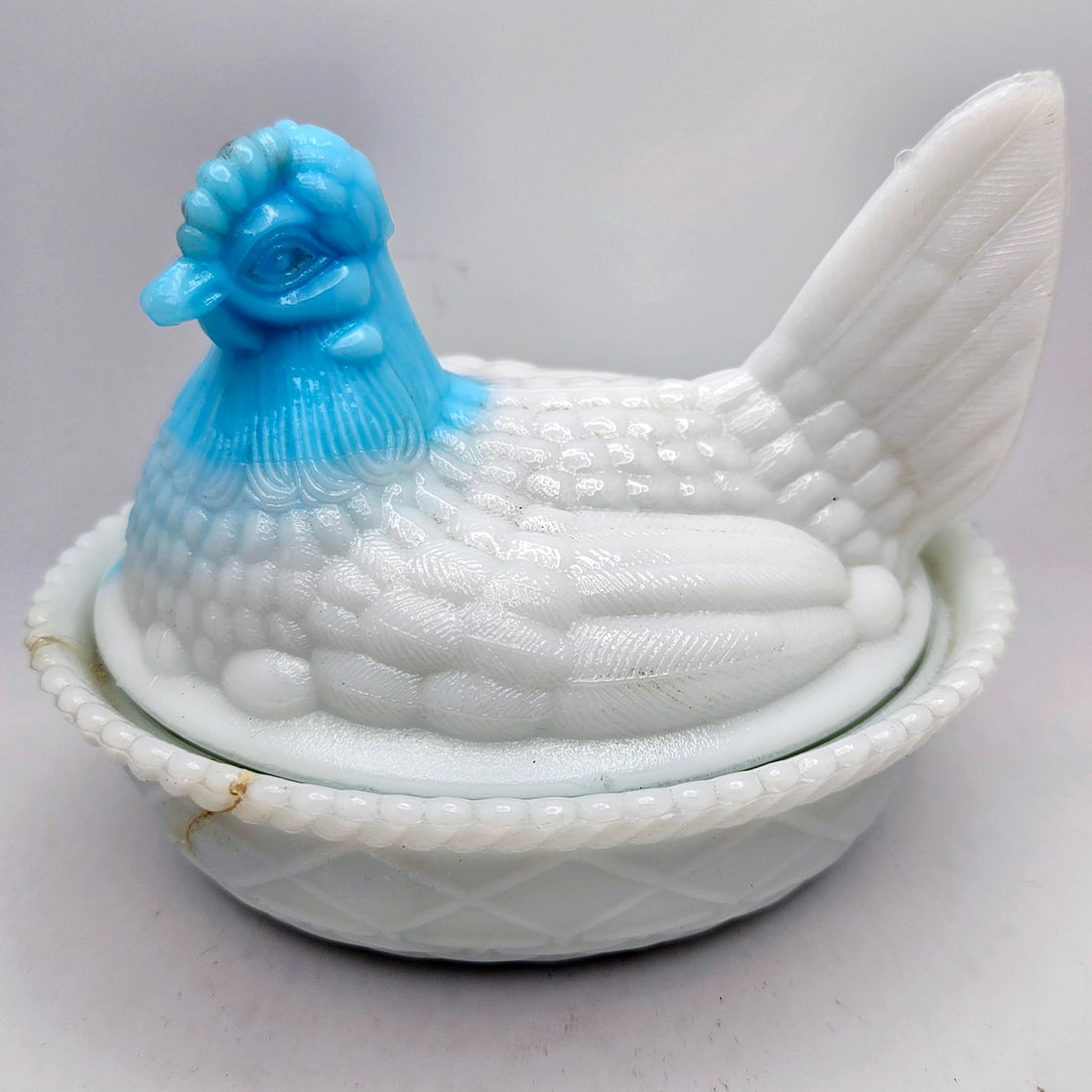 Westmoreland White Milk Glass with Light Blue Head Hen on the Nest: Title: Westmoreland White Milk Glass with Light Blue Head Hen on the Nest Description: Westmoreland White Milk Glass with Light Blue Head Hen on the Nest Measures approx.. 5.75” wide x 4”