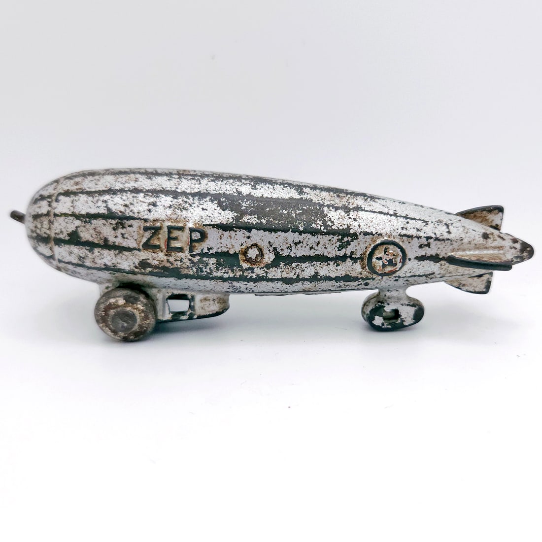 Dent Hardware Co. Cast Iron Zep Zeppelin Blimp Airship circa 1930: Title: Dent Hardware Co. Cast Iron Zep Zeppelin Blimp Airship circa 1930 Description: Dent Hardware Co. Cast Iron Zep Zeppelin Blimp Airship circa 1930 Original silver paint with some paint loss. Meas