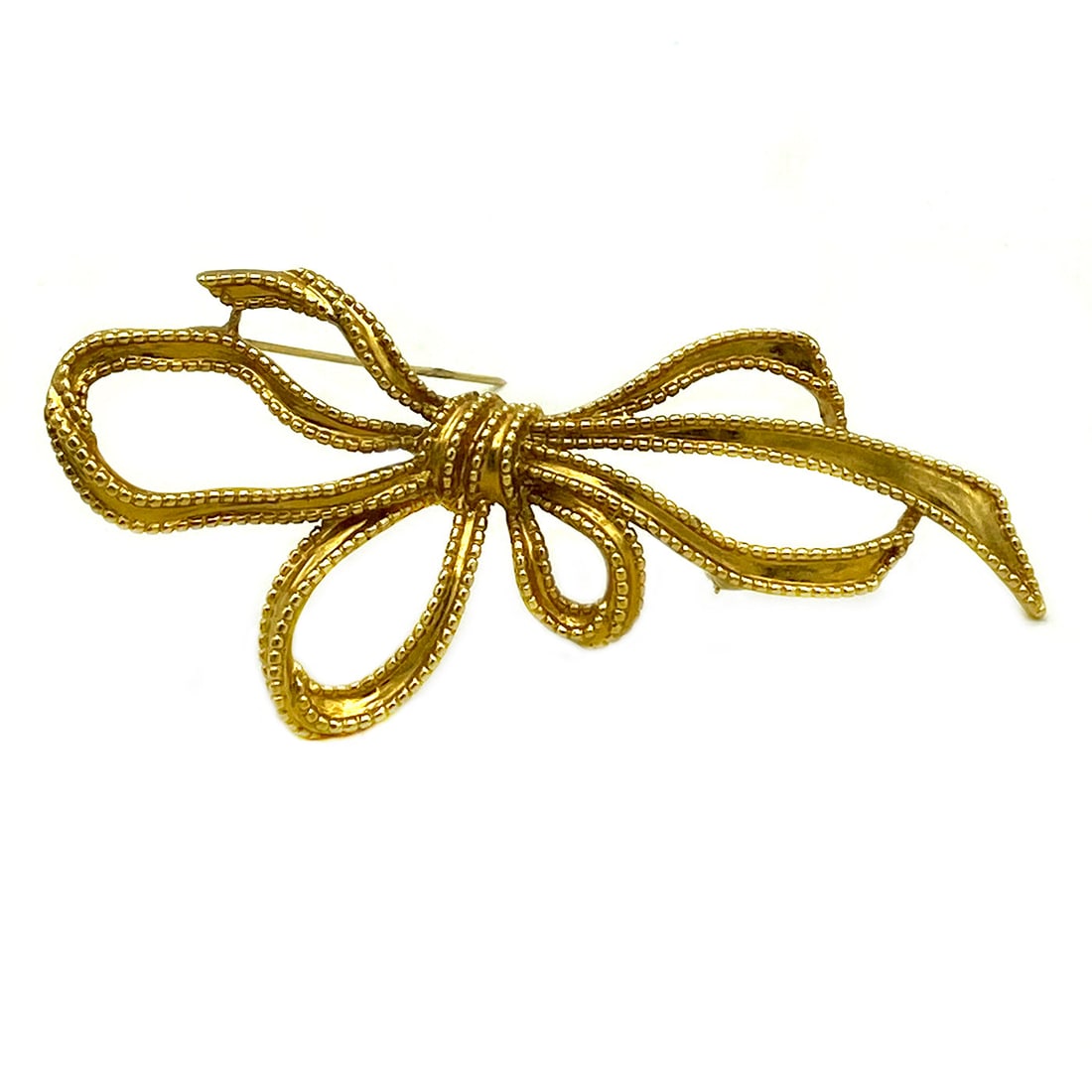 Trifari Golden Ribbon Brooch: This is a vintage signed Trifri gold-tone metal ribbon brooch. Dimensions: 4 x 2.25 x 0.25 inch Reserve: $48.00 Shipping: Domestic: Flat-rate of $12.00 to anywhere within the contiguous U.S. Internati