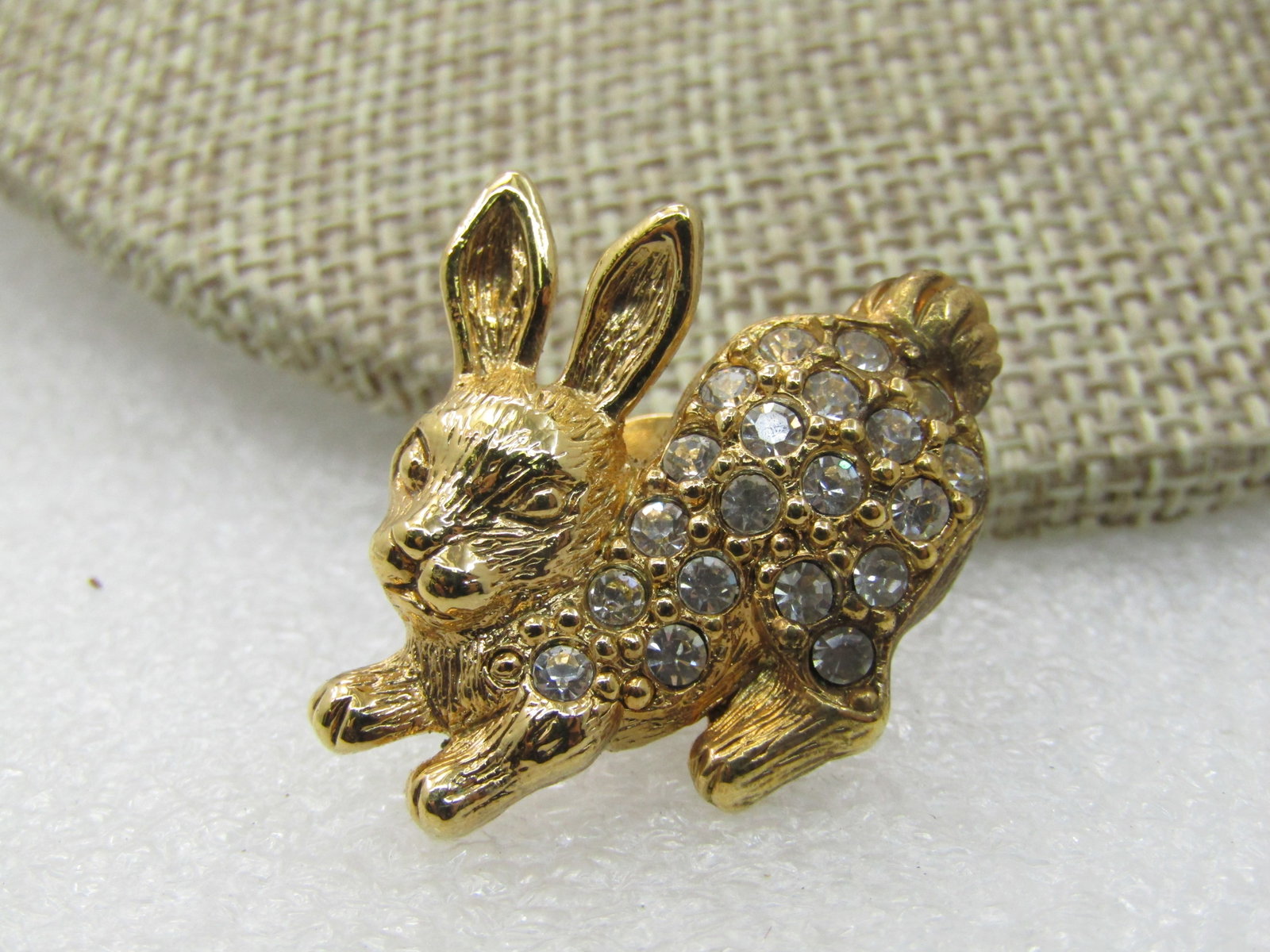 Vintage Pave Rhinestone Rabbit Tack Pin, Avon, 1": Vintage Pave Rhinestone Rabbit Tack Pin, Avon, 1" Gold tone and post mid-century. Clear rhinestones pave-set from his neck to his butt. Very cute, single post tack pin with clutch, unisex design. Good