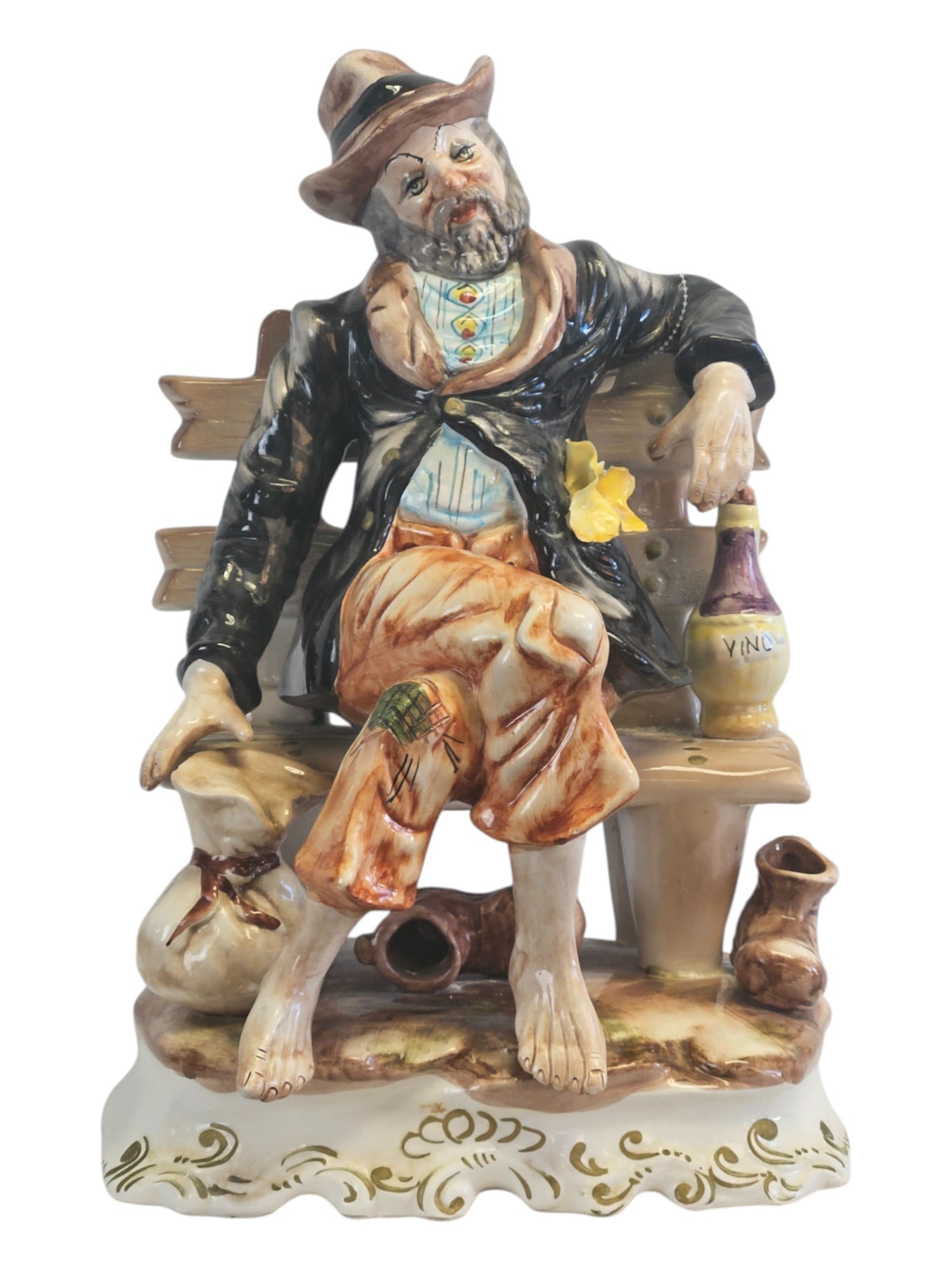 Italian Capodimonte Porcelain Figurine: Title:Italian Capodimonte Porcelain Figurine Description:This charming vintage Italian Capodimonte porcelain figurine is a delightful example of Italian decorative artistry. The piece depicts a weary