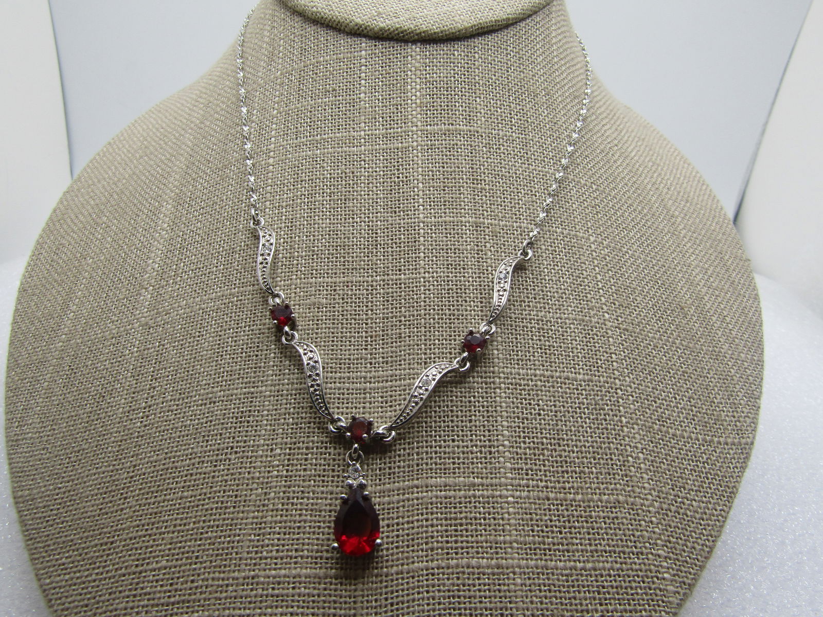 Vintage Red & Clear Rhinestone Lavalier Necklace, 16", 1980's-1990's.: Vintage Red & Clear Rhinestone Lavalier Necklace, 16", 1980's-1990's. Red rhinestone pear-shaped drop with red round rhienstones set in the front piece with clear rhinestones set in each long link. Tw