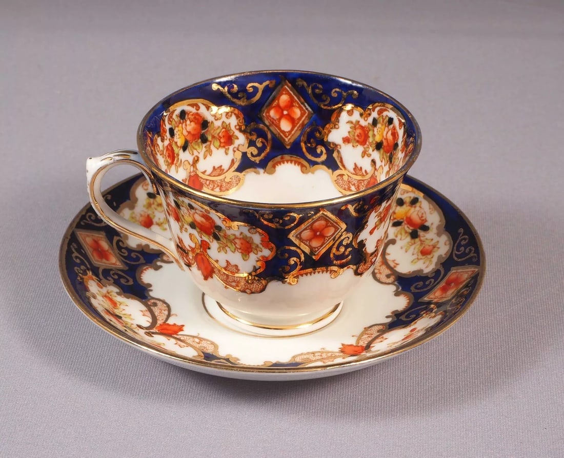Royal Albert Crown China Heirloom IMARI Coffee Tea cup Saucer Set COBALT Blue: This is a beautiful and timeless set of Tea/Coffee cup and Saucer in a rare Unnamed Heirloom Pattern, made made by Royal Albert in England. The pattern is a lovely cobalt blue, rust and ivory Imari st