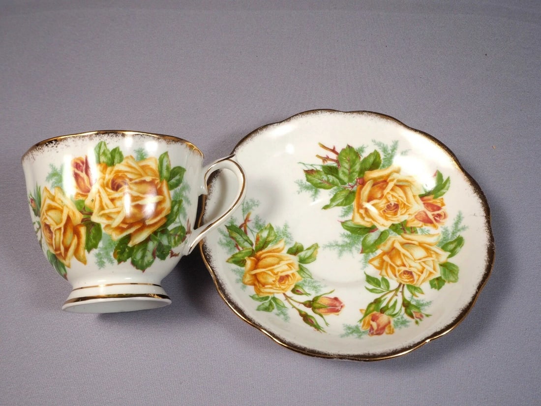 Royal Albert Yellow Tea Rose Bone China Coffee Tea cup Saucer England 3 1/4": This an absolutely stunning Fine Bone China set of Tea/Coffee cup and Saucer, from the famous Yellow Tea rose Collection. The set is made by Royal Albert in England. It is properly marked with Royal A